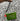 Customizable crossbody bag that features "HMS" initial applique in red and green sparkly canvas on a green glitter infused vinyl. Crossbody strap is black nylon with white Julie Mollo doodles. 