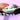 Inside of black vinyl clutch showing the Magic Wand x Julie Mollo sew in tag.