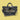 black glittery vinyl tote bag with the name "Christina" in cursive gold letters on the front. The bag features a removable shoulder strap with a fun, doodle-inspired pattern of stars, hearts, and shapes.