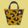 Sparkly black and gold leopard spots sewn onto a gold glitter infused vinyl handle bag. Handles are black nylon with white Julie Mollo! doodles. On top of clutch is a cute XOXO zipper that is custom to Julie Mollo!.