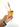 Hand holding a mimosa with an XOXO signature drink stirrer. 